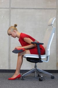 yoga on chair in office - business woman exercising